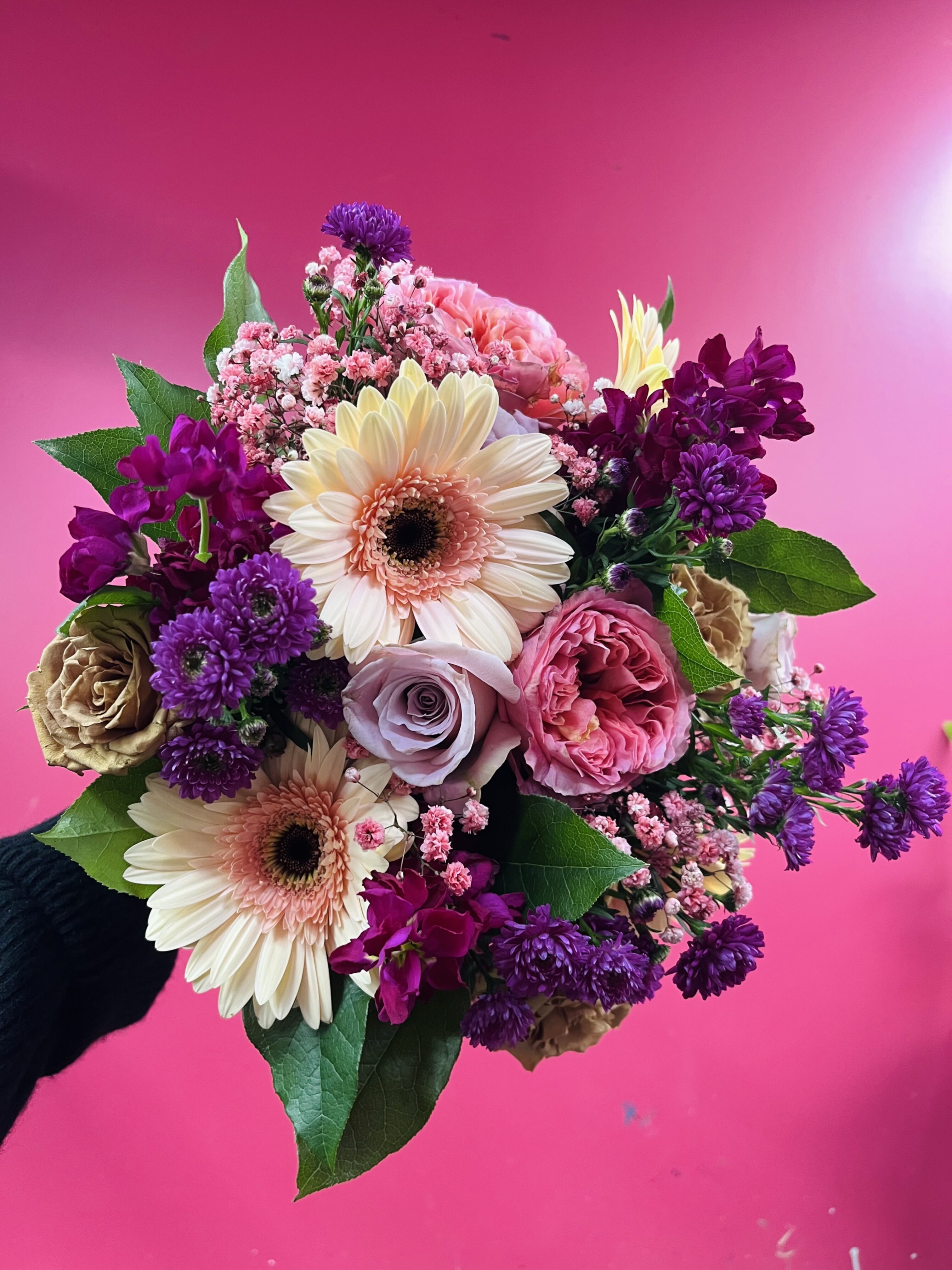 Colorful bouquet with gerberas and roses